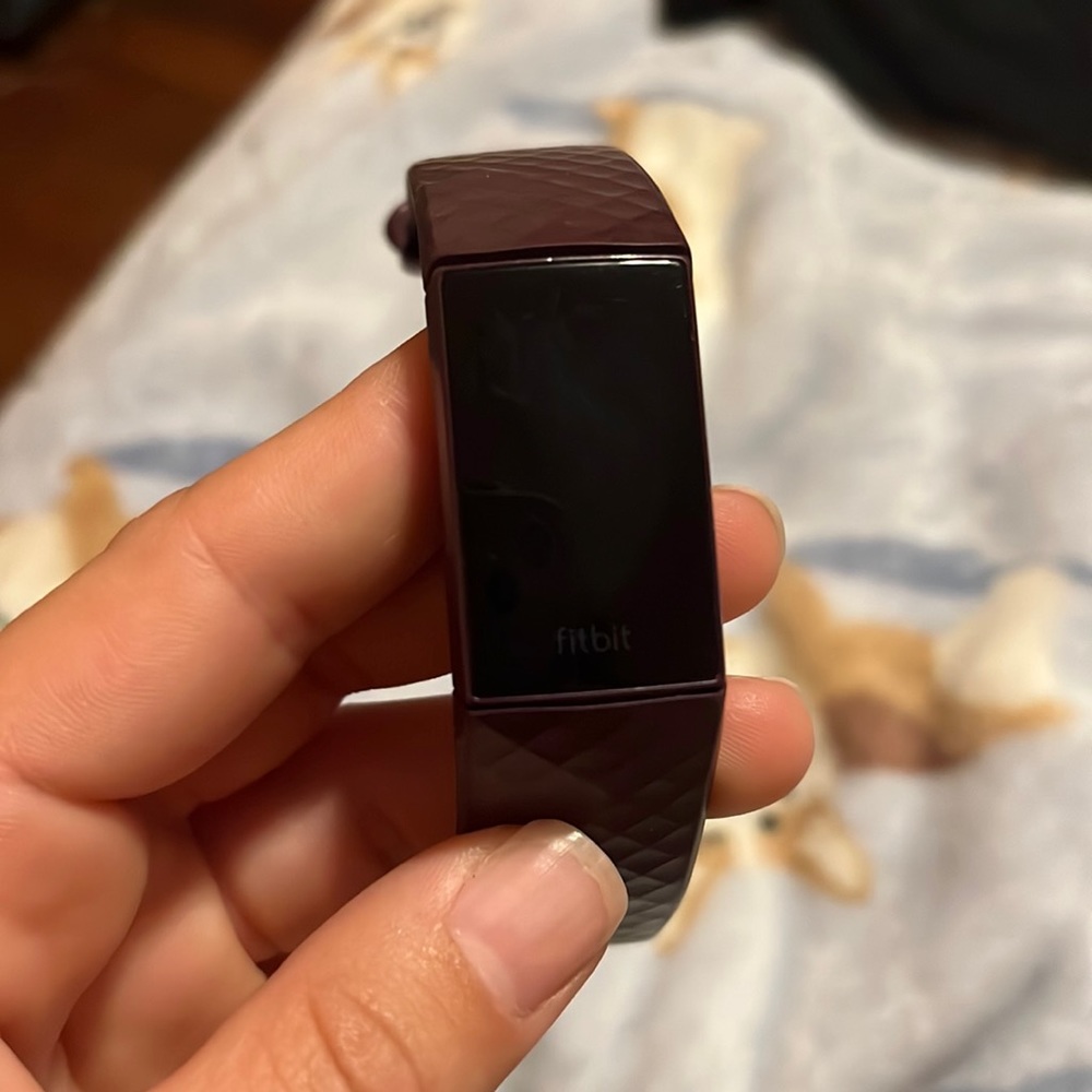 Purple fit-bit with charger